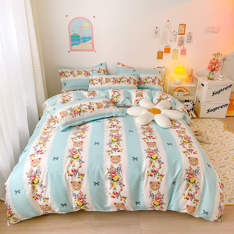Pastel blue and white bedding with bear faces and floral design