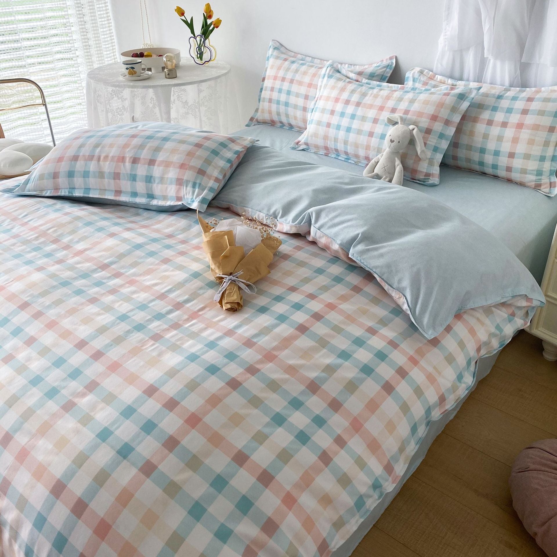 Soft pastel plaid bedding set with blue and peach tones