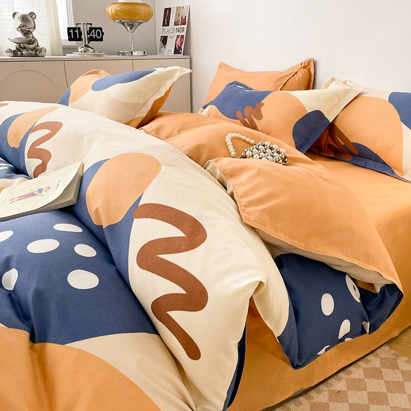 Abstract bedding set with bold shapes and vibrant orange, blue colors