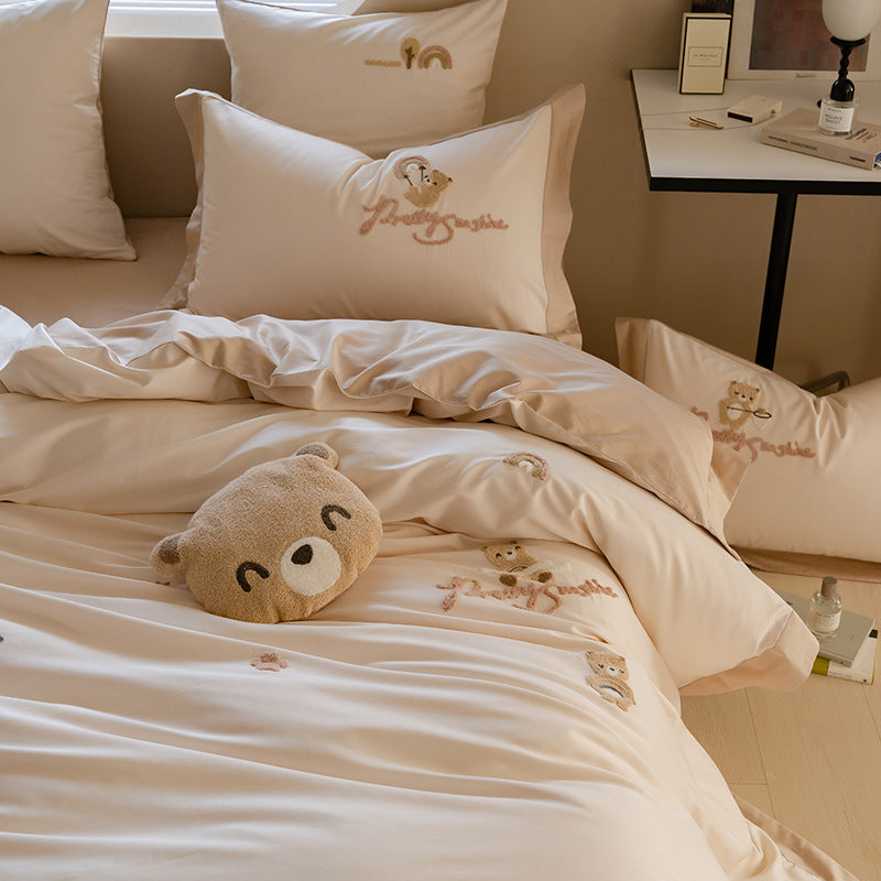 Soft beige bedding set with bear embroidery and rainbow accents