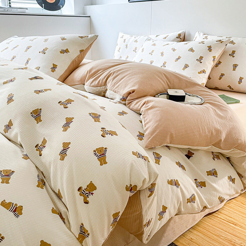 Bear print bedding set with striped patterns in neutral tones