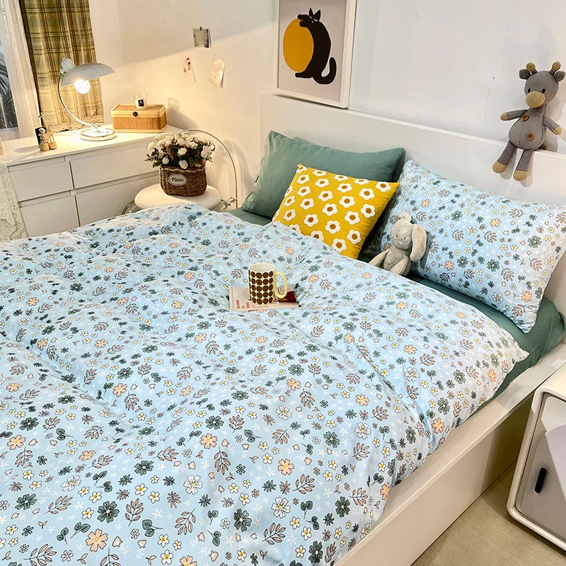 Cozy light blue floral bedding set with pillows and decor