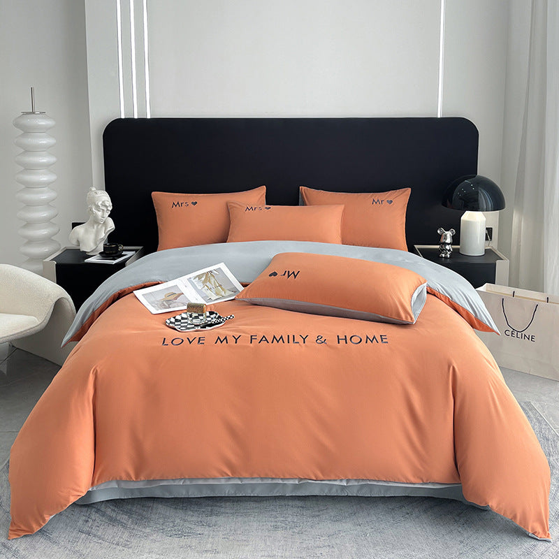 Stylish orange and gray bedding set with a modern aesthetic