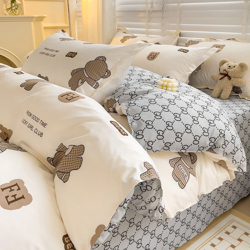 Cozy beige bedding set with teddy bear patterns and logos