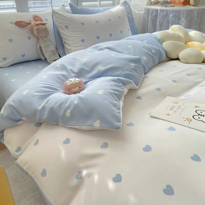 Soft blue and white bedding set with heart pattern design