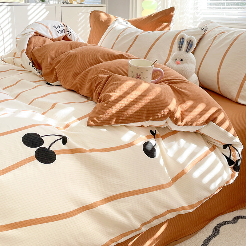 Cozy brown and white bedding with striped design and cherry print