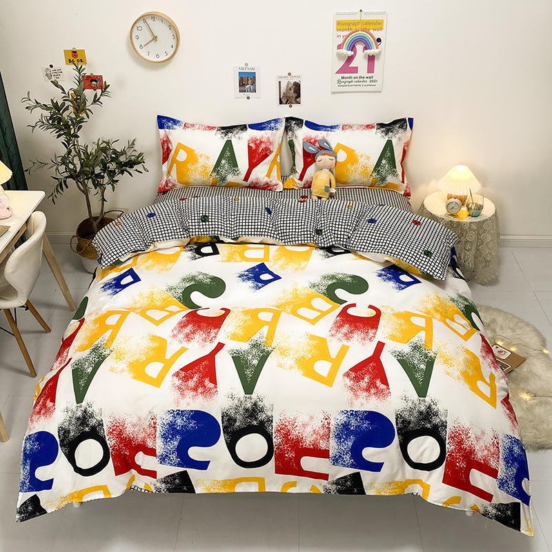 Colorful bedding set with bold alphabet print and checkered pillows