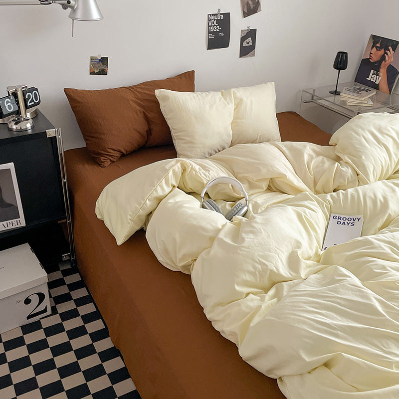 Cozy cream bedding set with brown pillows in a stylish bedroom