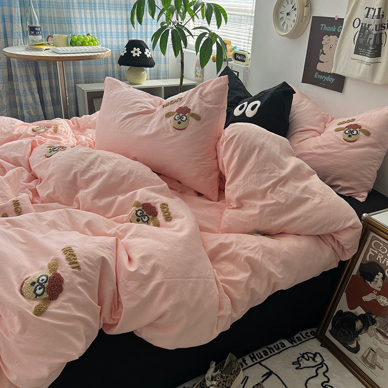 Pink bedding set with cute sheep patterns and pillows