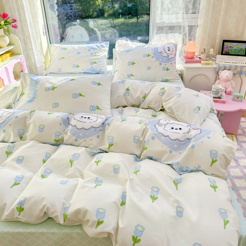 Bedding with a cute sheep and flower pattern in blue and white