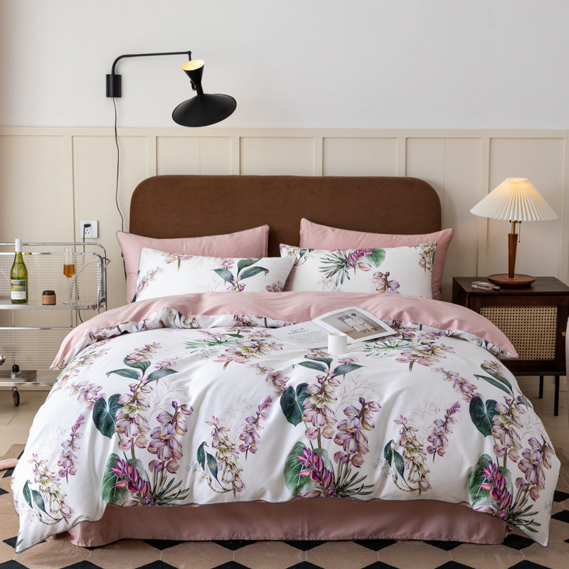 Elegant floral bedding set with blush pink accents and pillows