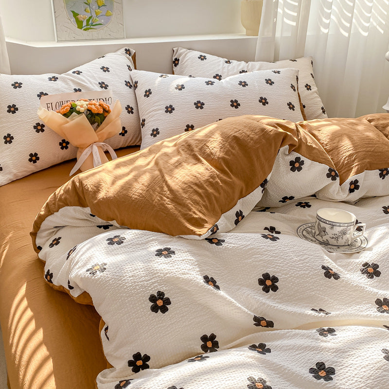 Floral patterned bedding set with brown accents and soft tones