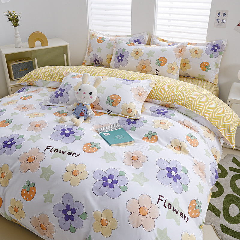 White bedding set with colorful floral and fruit patterns