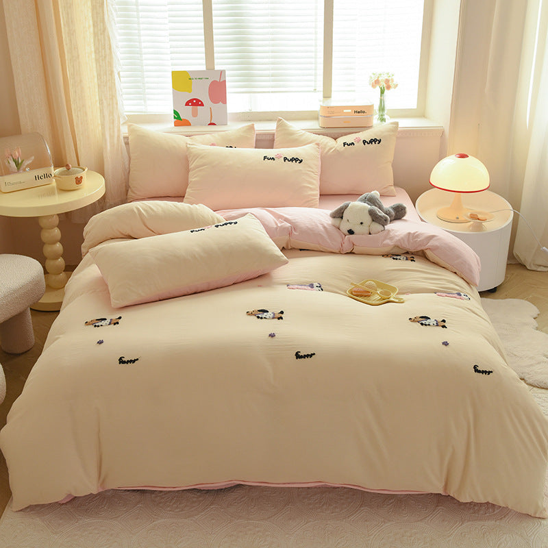 Cozy pink bedding set with embroidered puppies and fun design