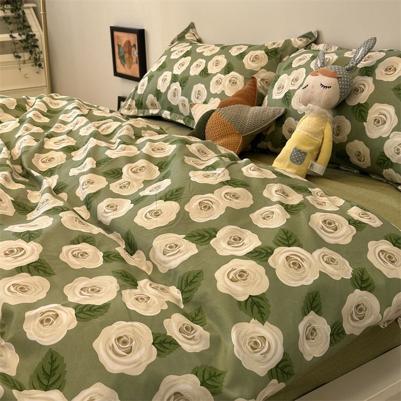 Elegant bedding set with white roses on a green background