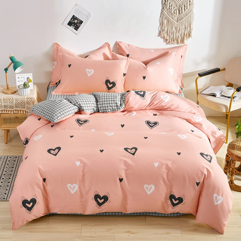 Cozy pink bedding set with black and white heart patterns