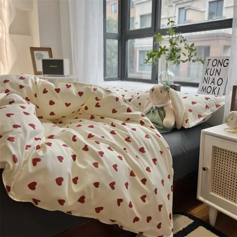 Cozy bedding set with red heart pattern on white fabric