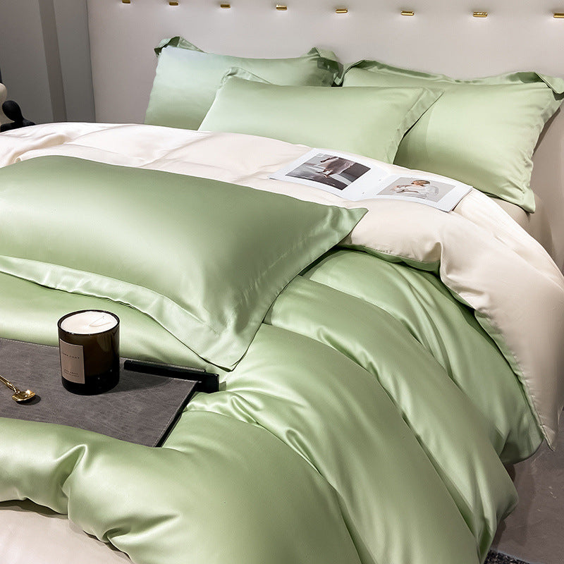 Elegant green and white satin bedding set with pillows