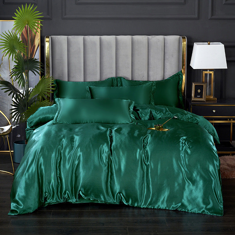 Luxurious green satin bedding with matching pillows and soft shine