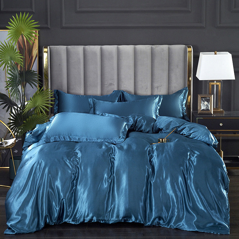 Sophisticated teal satin bedding set with matching pillows