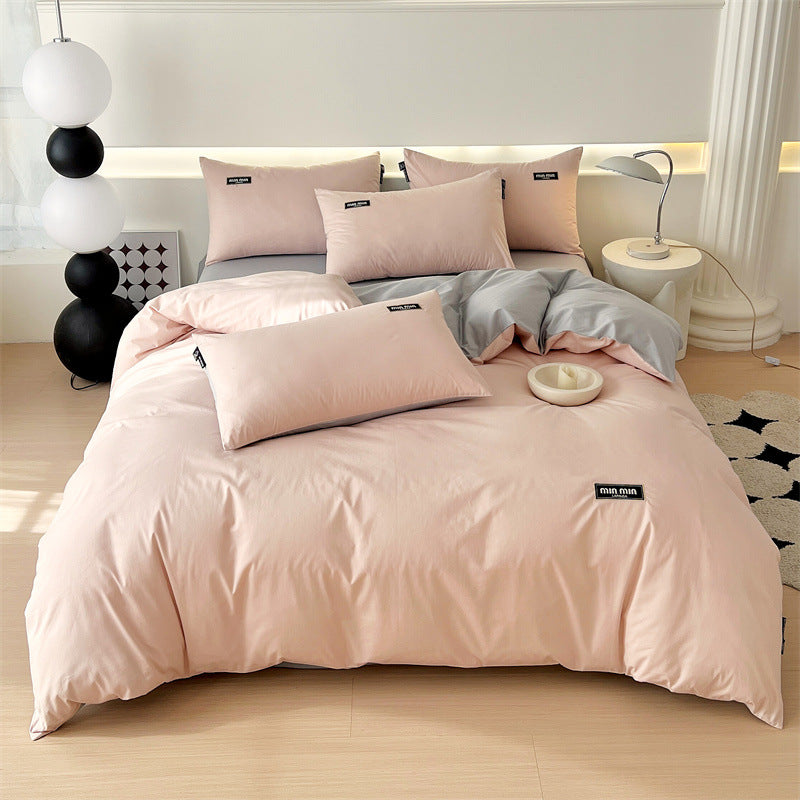 Elegant pink and gray bedding set with a modern minimalist design