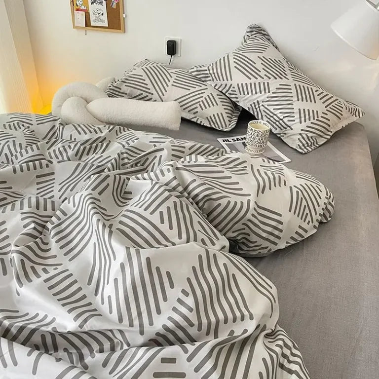 Modern grey and white bedding with a bold geometric pattern