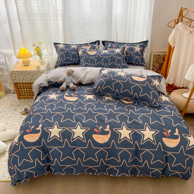 Dark blue bedding with outlined stars and cute whale prints