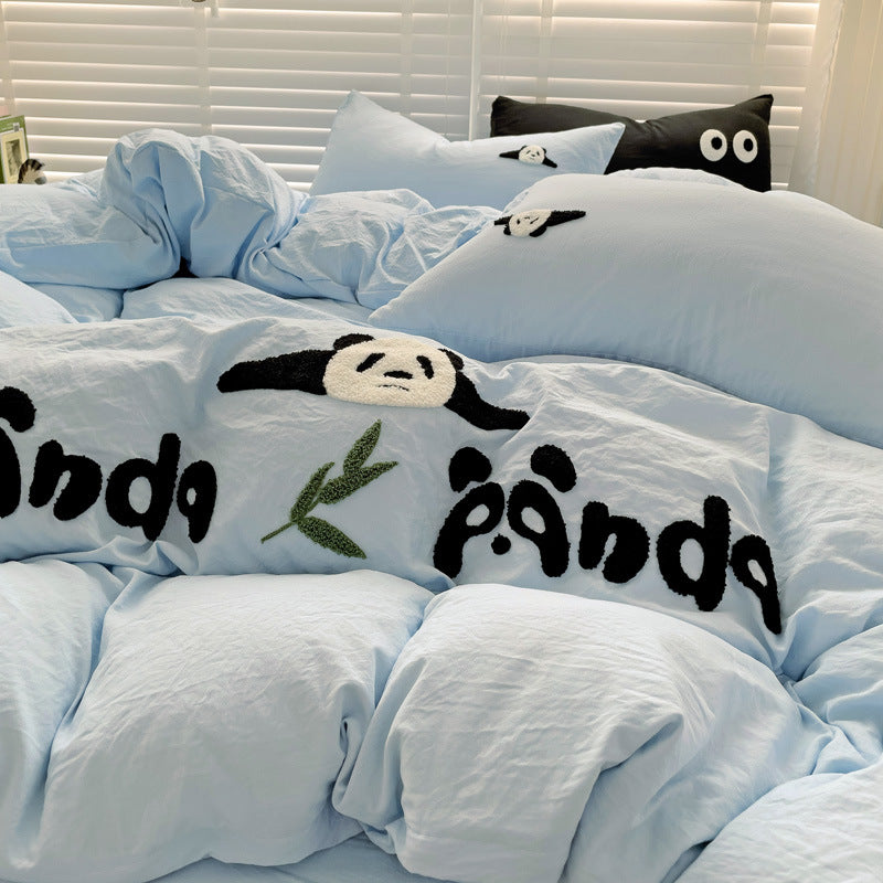 Light blue bedding with panda embroidery and leaf details