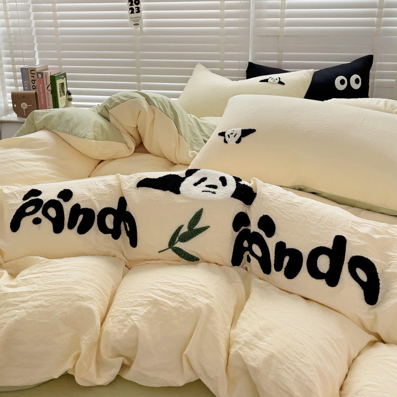 Yellow bedding with panda embroidery and leaf details, soft and cozy