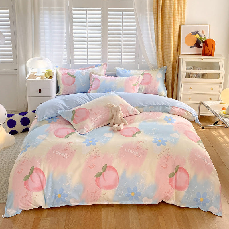 Soft pastel bedding with peach prints, blue flowers, and hearts