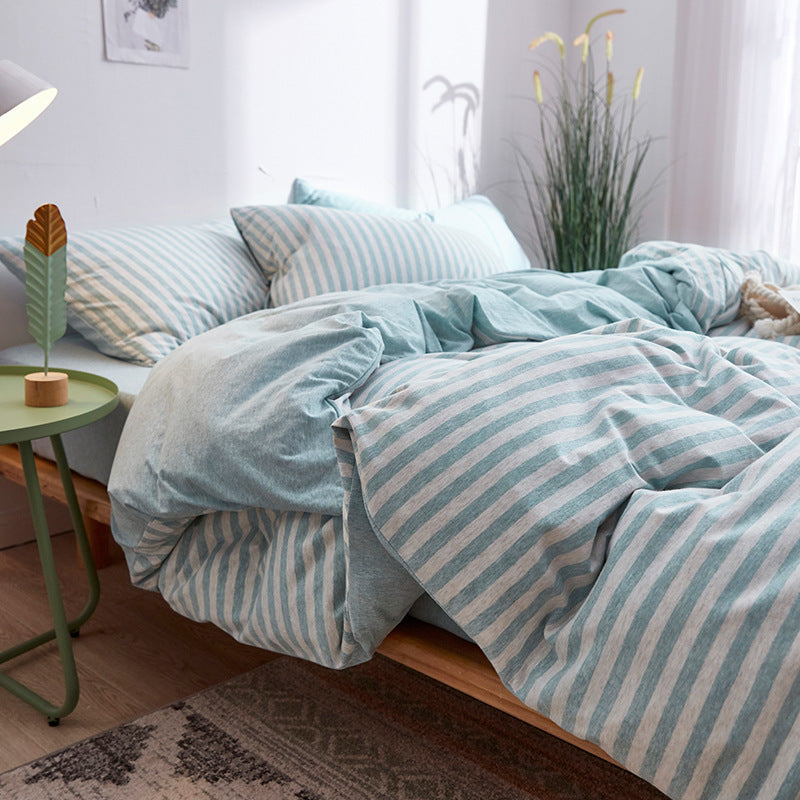 Soft pastel blue and white striped bedding with cozy fabric