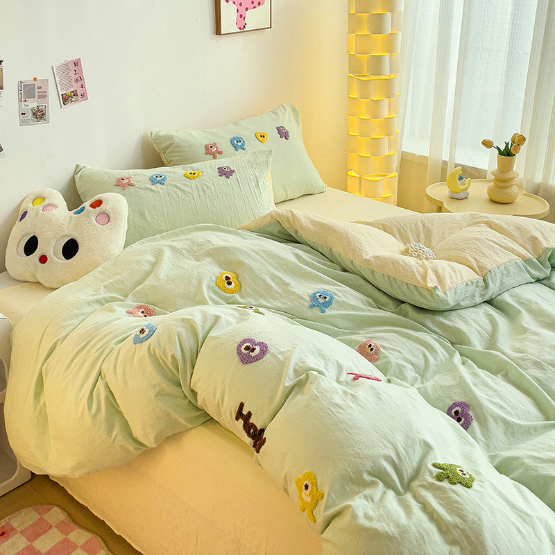 Cute pastel bedding set with colorful monster embroidery design