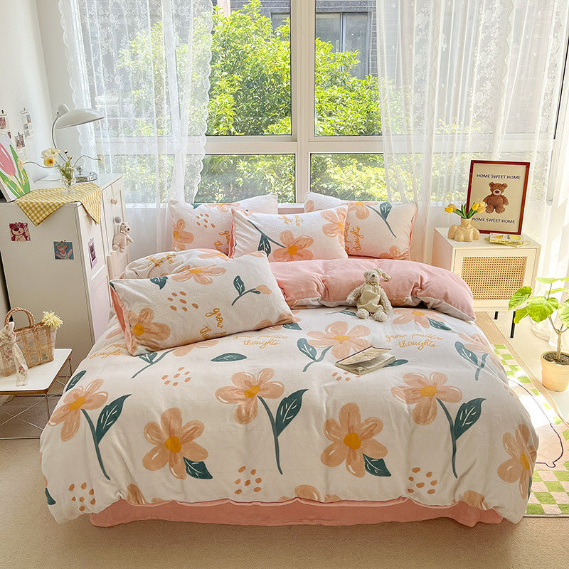 Soft peach and white bedding set with a delicate floral design