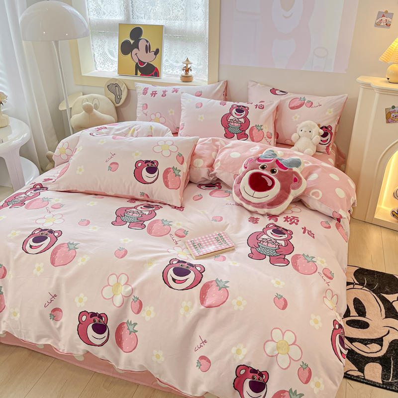 Cute pink bedding with bears, strawberries, and floral accents