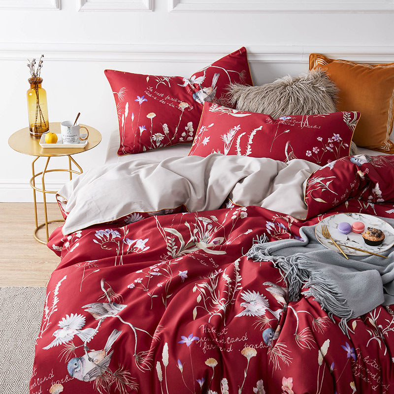 Elegant red bedding set with floral design and bird prints