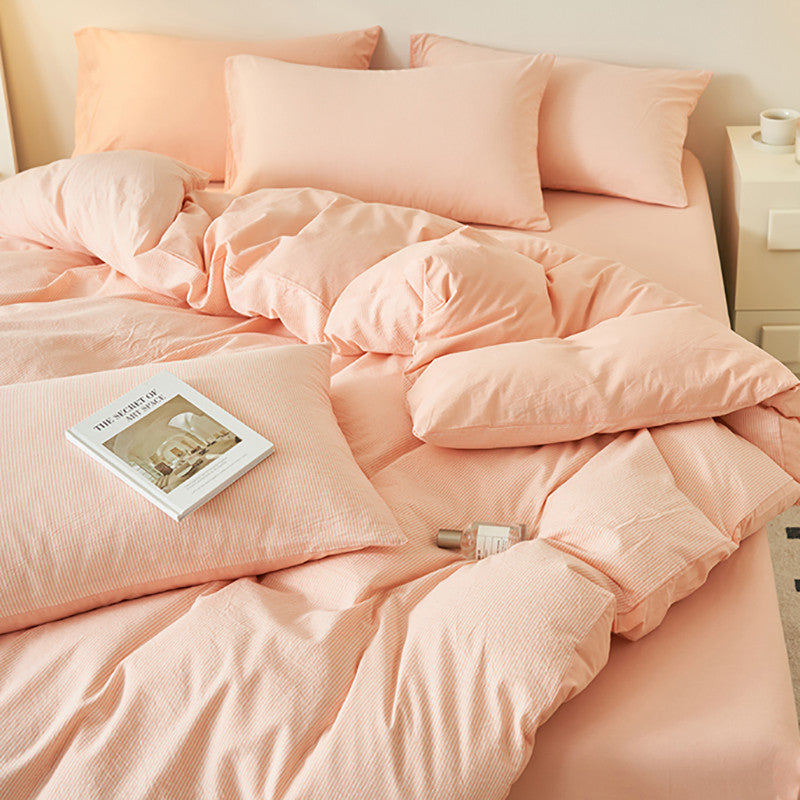 Light pink bedding set with matching pillows in a soft fabric