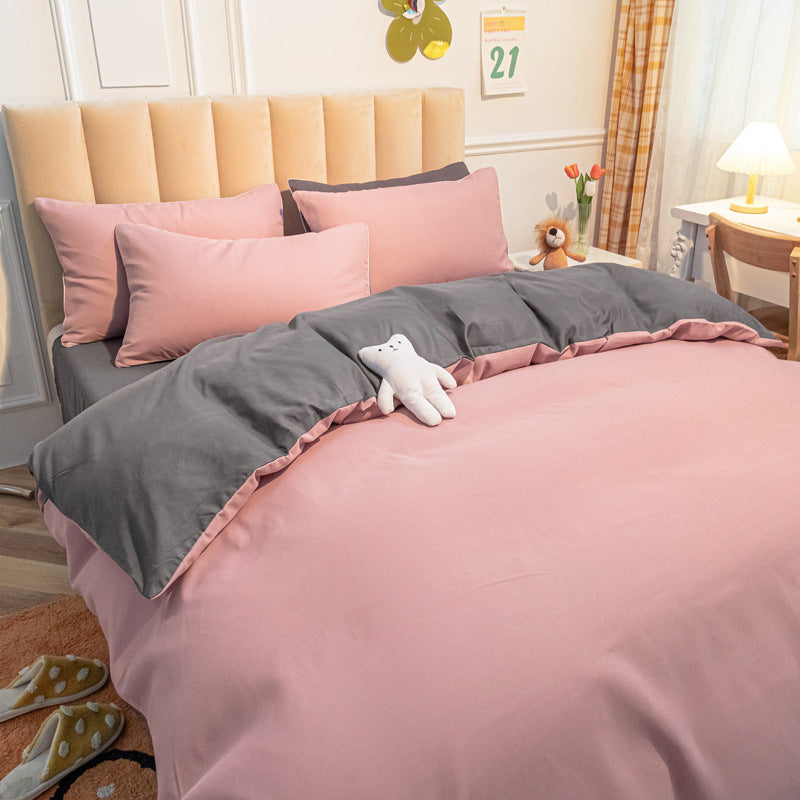 Elegant pink and gray bedding set with soft fabric and matching pillows