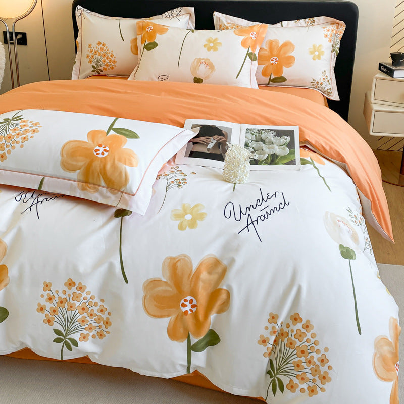 Elegant white bedding set with orange floral print and pillows