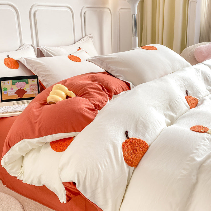 Cozy white bedding set with embroidered orange fruit design