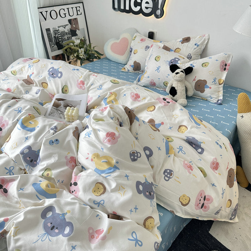 White bedding set with colorful bear and cookie designs