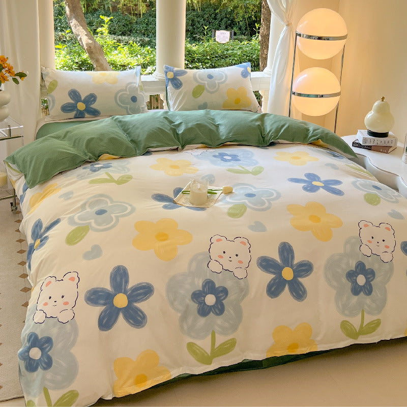 Cheerful white bedding featuring blue and yellow flowers with bear faces