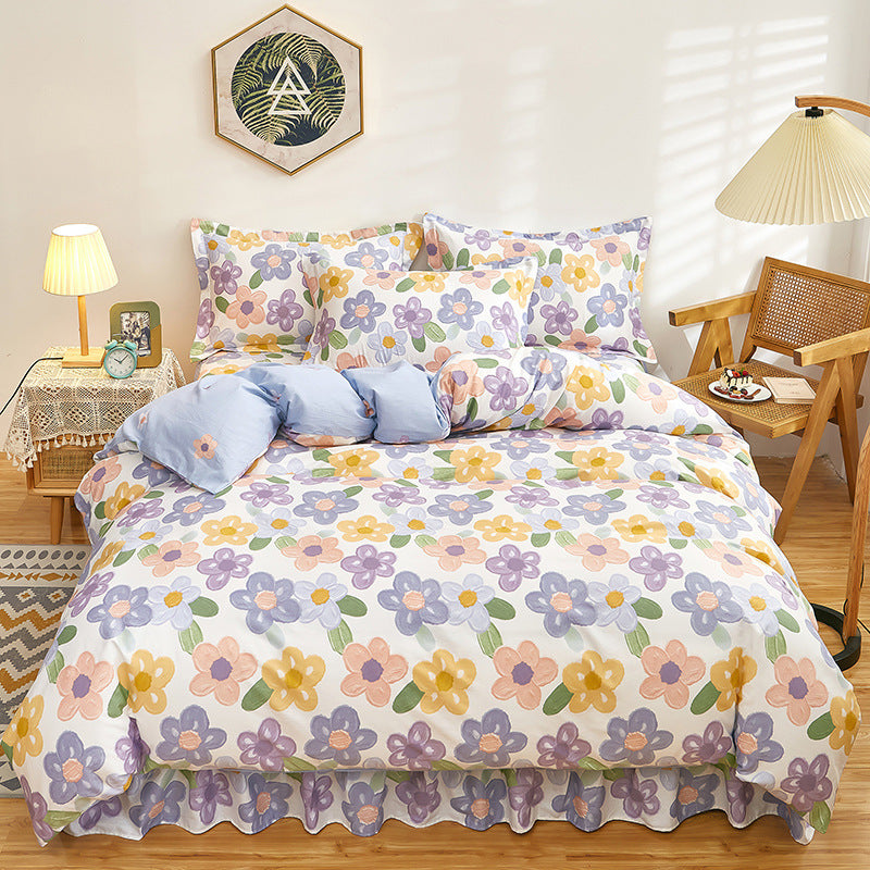 Elegant white bedding with pastel flowers in yellow, purple, and pink