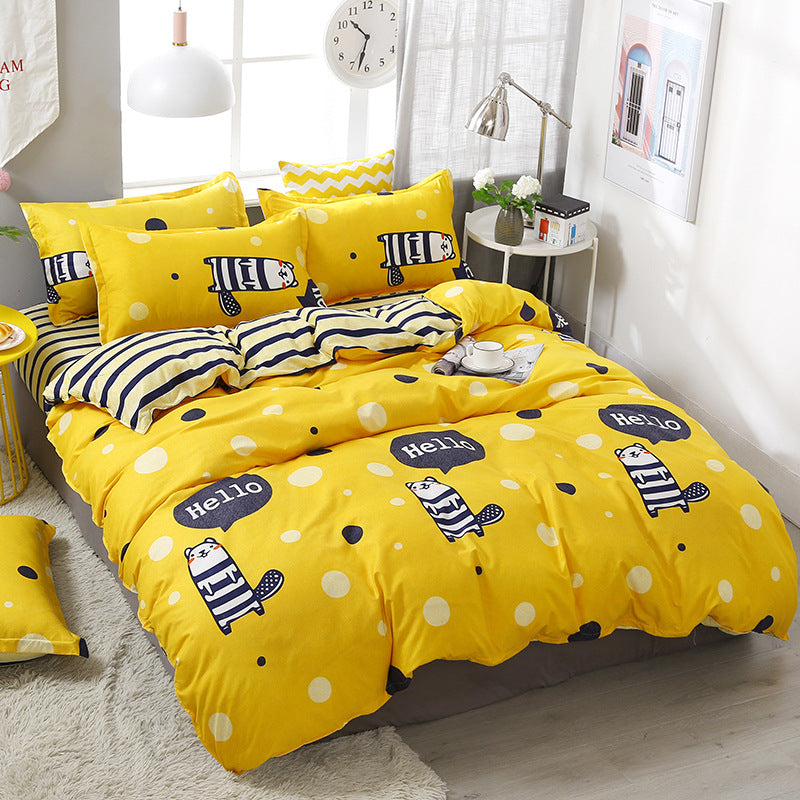 Bright yellow bedding with cute animal prints and polka dots