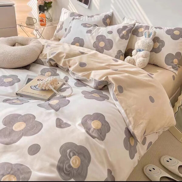 Bedding set featuring large flower patterns in soft neutral shades