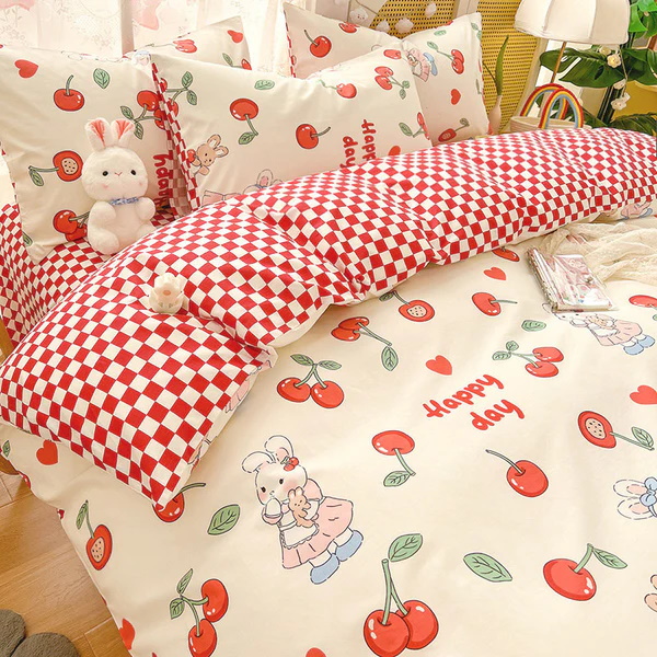 Cute red and white bedding with cherries, bunnies, and gingham pattern