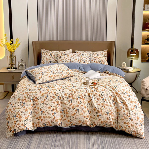 Elegant cream bedding set with intricate floral patterns and blue accents