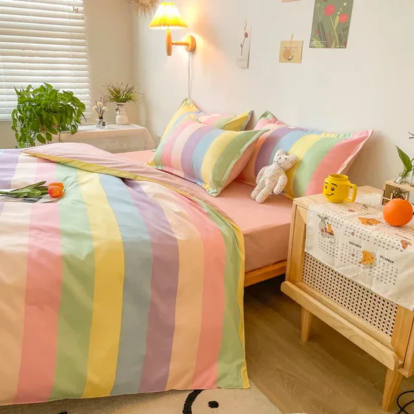 Colorful pastel striped bedding set with soft pillows and decor