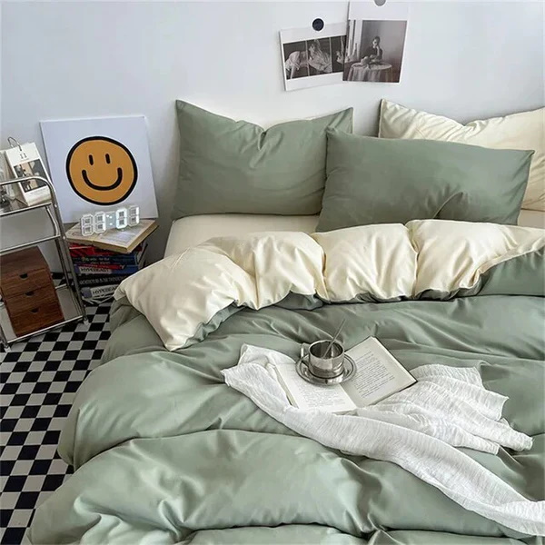 Elegant sage green bedding set with cream accents in a cozy bedroom