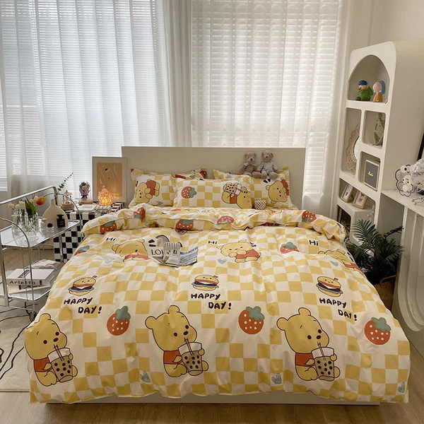 Yellow checkered bedding featuring Winnie the Pooh with food items